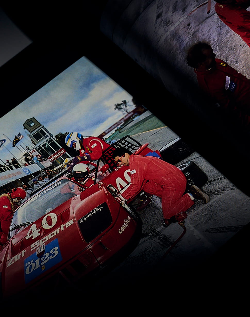 Book page with pit stop scene of the Ferrari F40 number 40 Art Sports