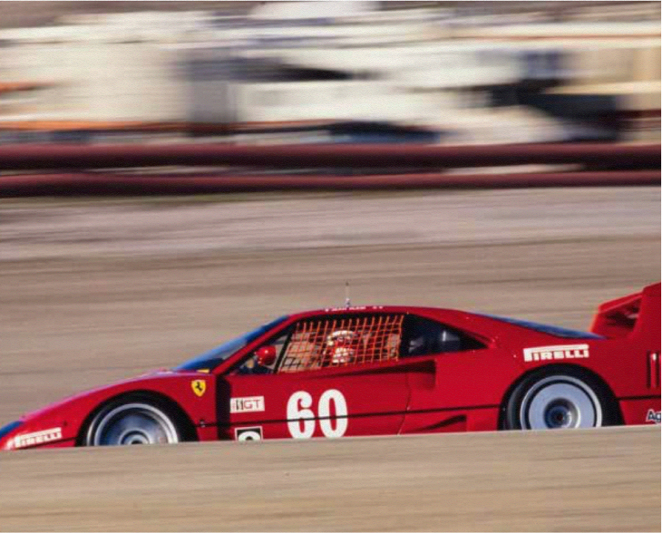 Red Ferrari F40 Competizione number 60 racing on American circuit with Pirelli sponsorship