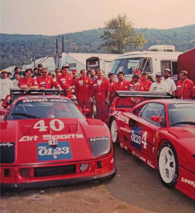 Team lined up behind the two Ferrari F40 numbers 40 and 4 Art Sports in the American paddock