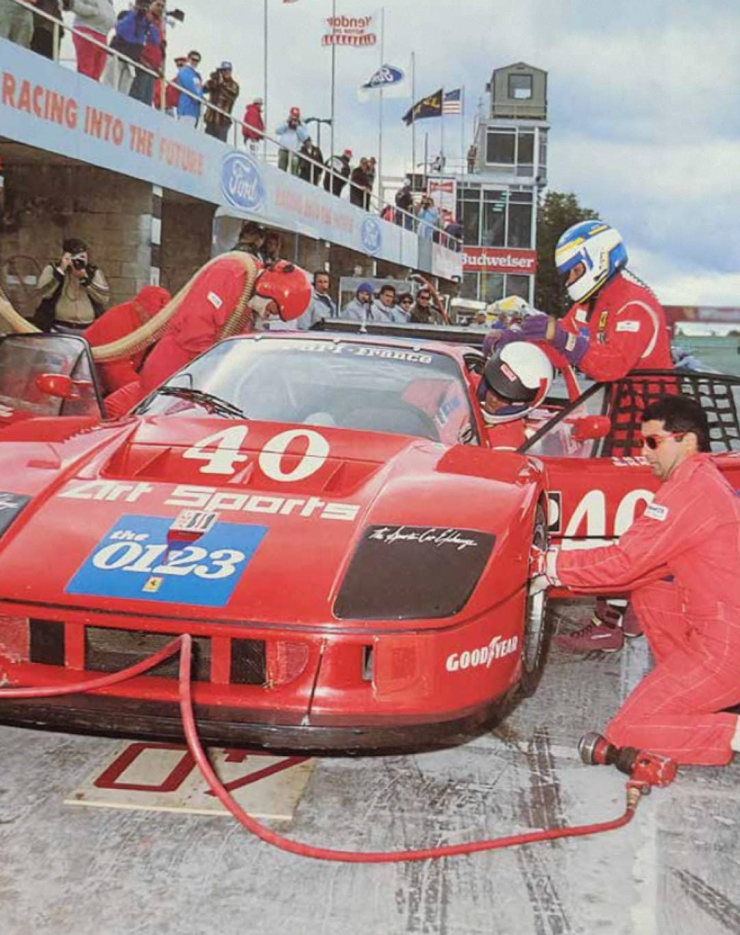 Pit stop of the Ferrari F40 number 40 Art Sports with mechanics working during IMSA race