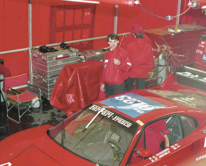 Francesco Calzavara in red team jacket in the circuit pit with the Ferrari F40